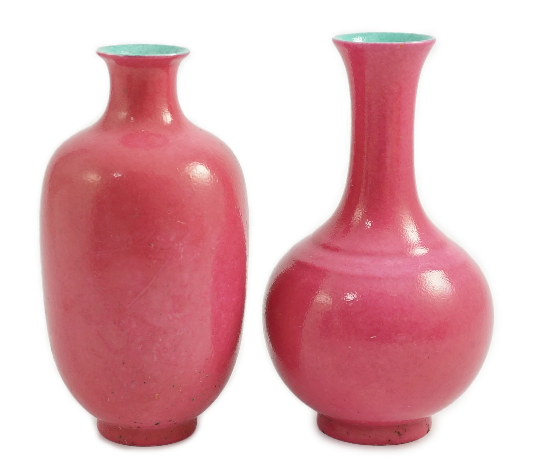 Two Chinese ruby ground vases, possibly Republic period, each with a printed four character Qianlong mark, 18.5 and 19.4cm high